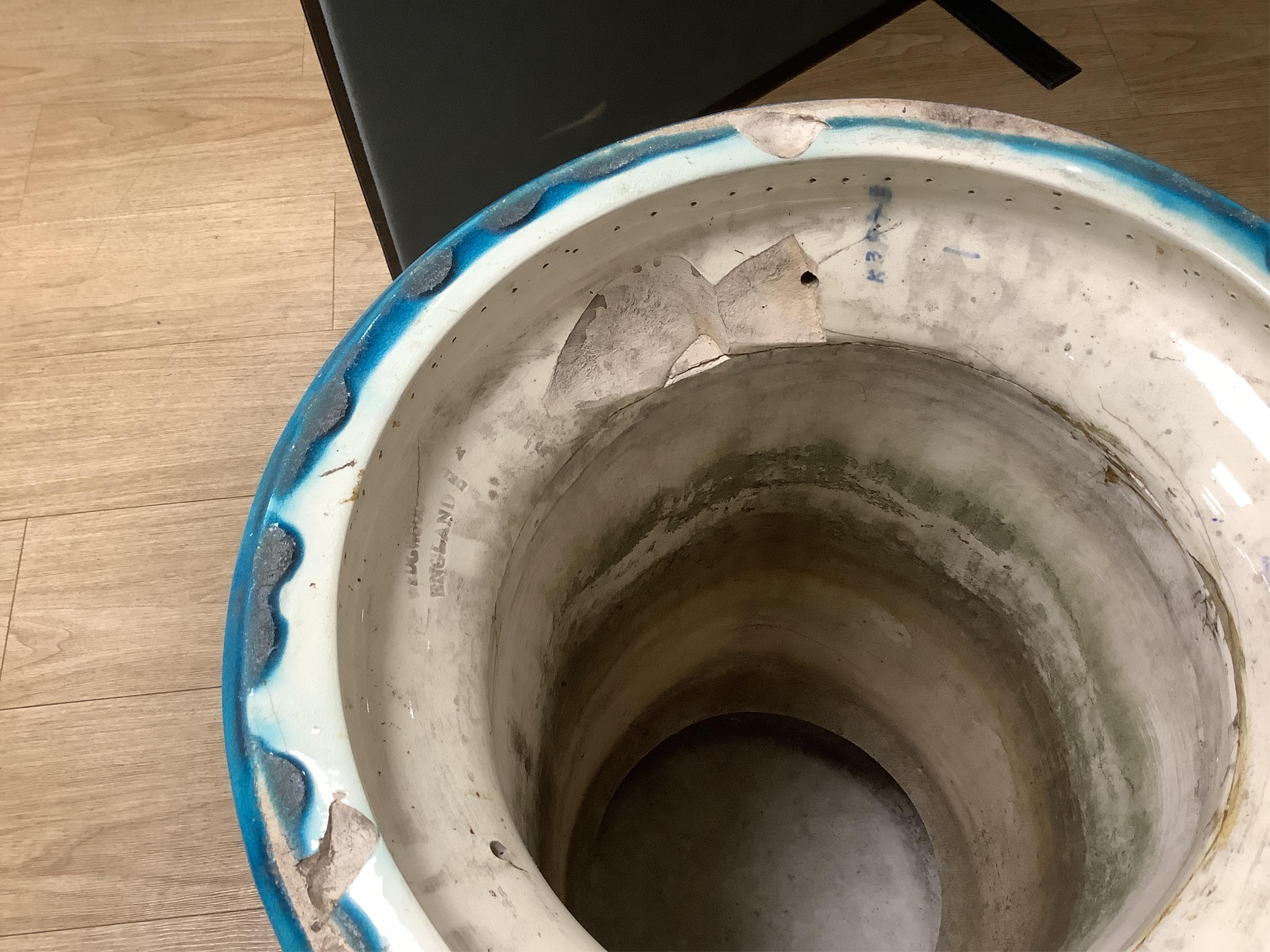 A Burmantofts style turquoise glazed jardiniere and a similar larger stand, decorated in relief, 90cm high